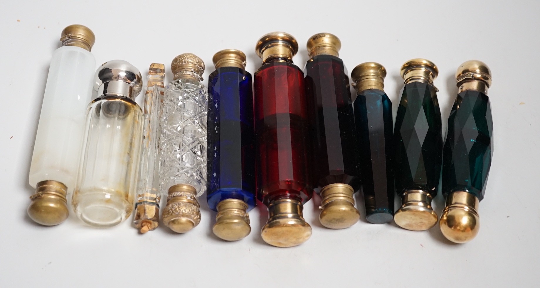 Seven 19th century coloured glass double ended scent bottles and three others